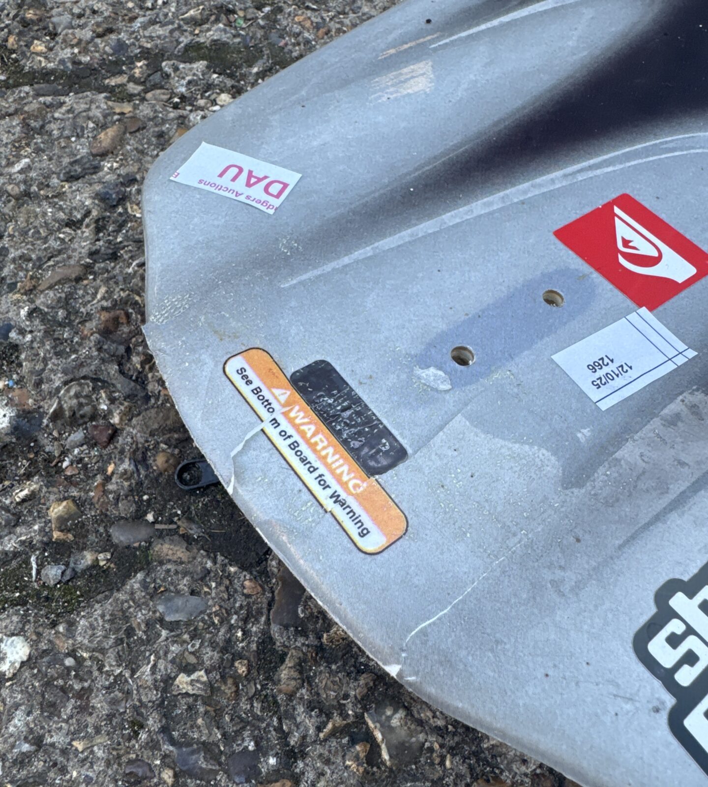 Close-up of delamination on the Liquid Force Omega wakeboard.