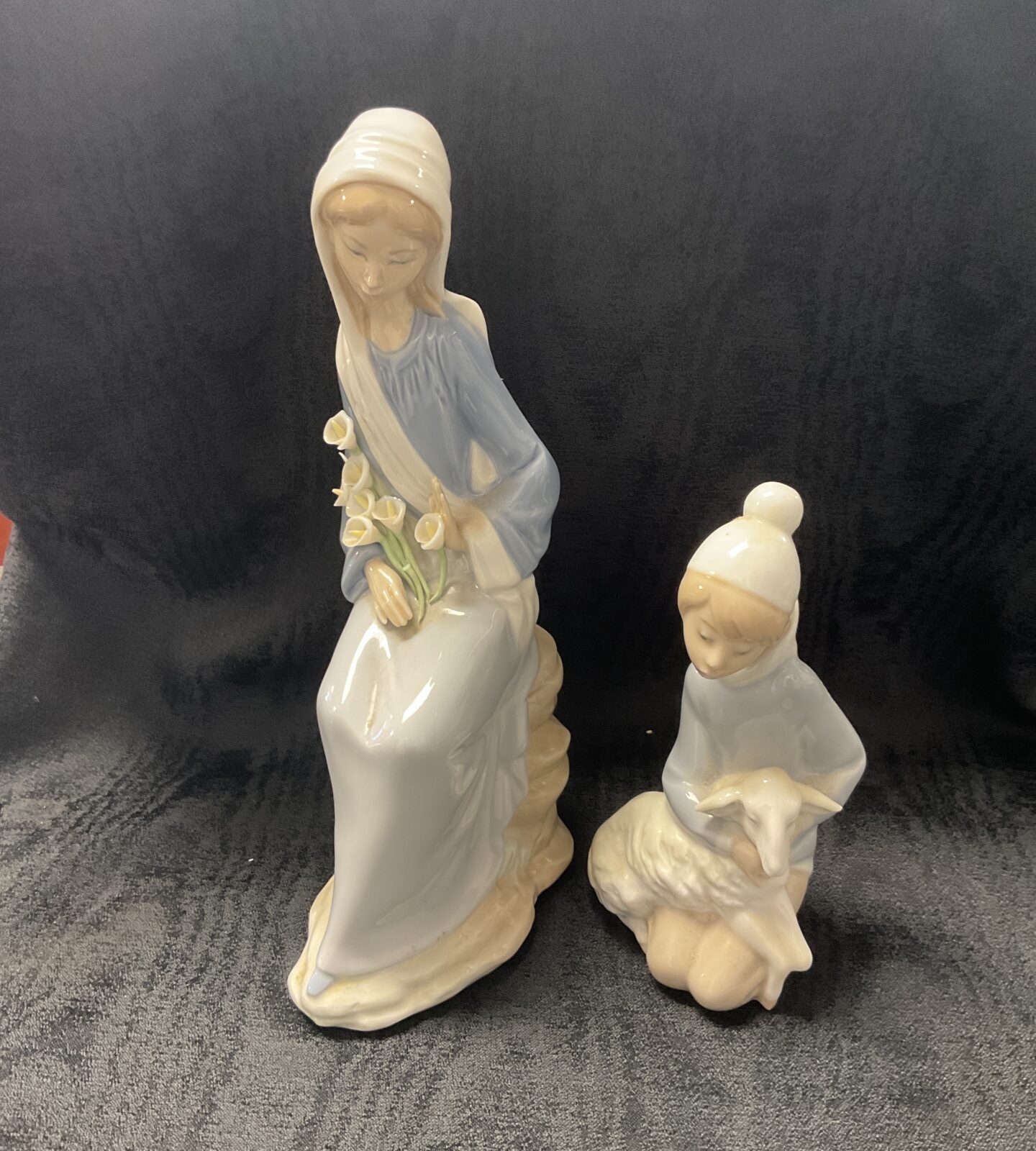 Pair of vintage Lladro porcelain figures, girl with flowers and lamb.