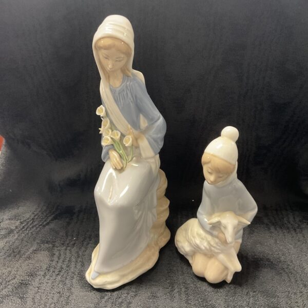 Pair of vintage Lladro porcelain figures, girl with flowers and lamb.