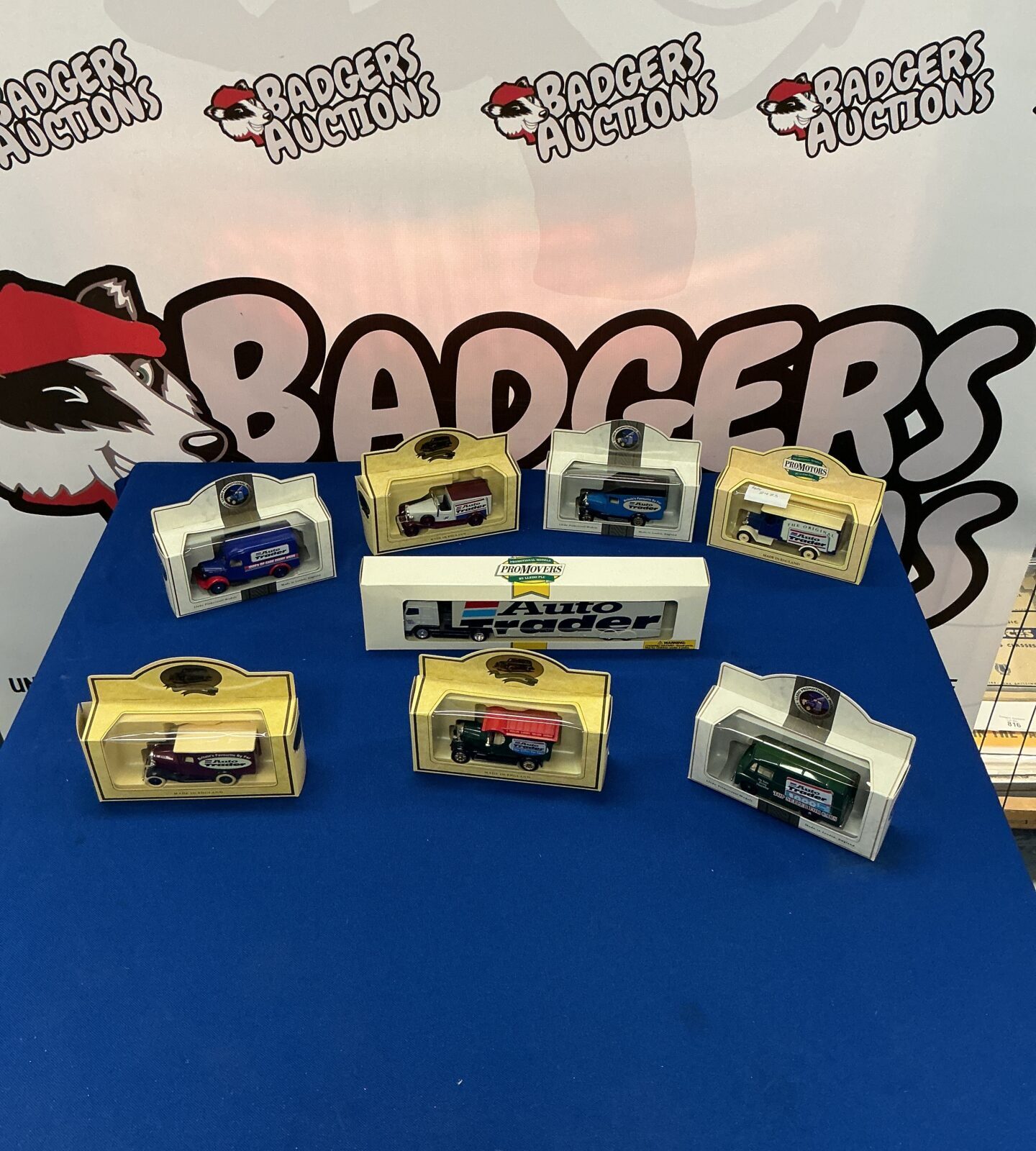 Vintage Lledo toy cars in original boxes, collectible diecast models.