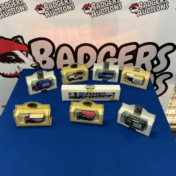 Vintage Lledo toy cars in original boxes, collectible diecast models.