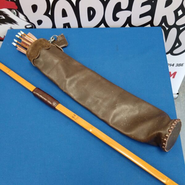 Traditional Amaranth longbow set with leather quiver and arrows.
