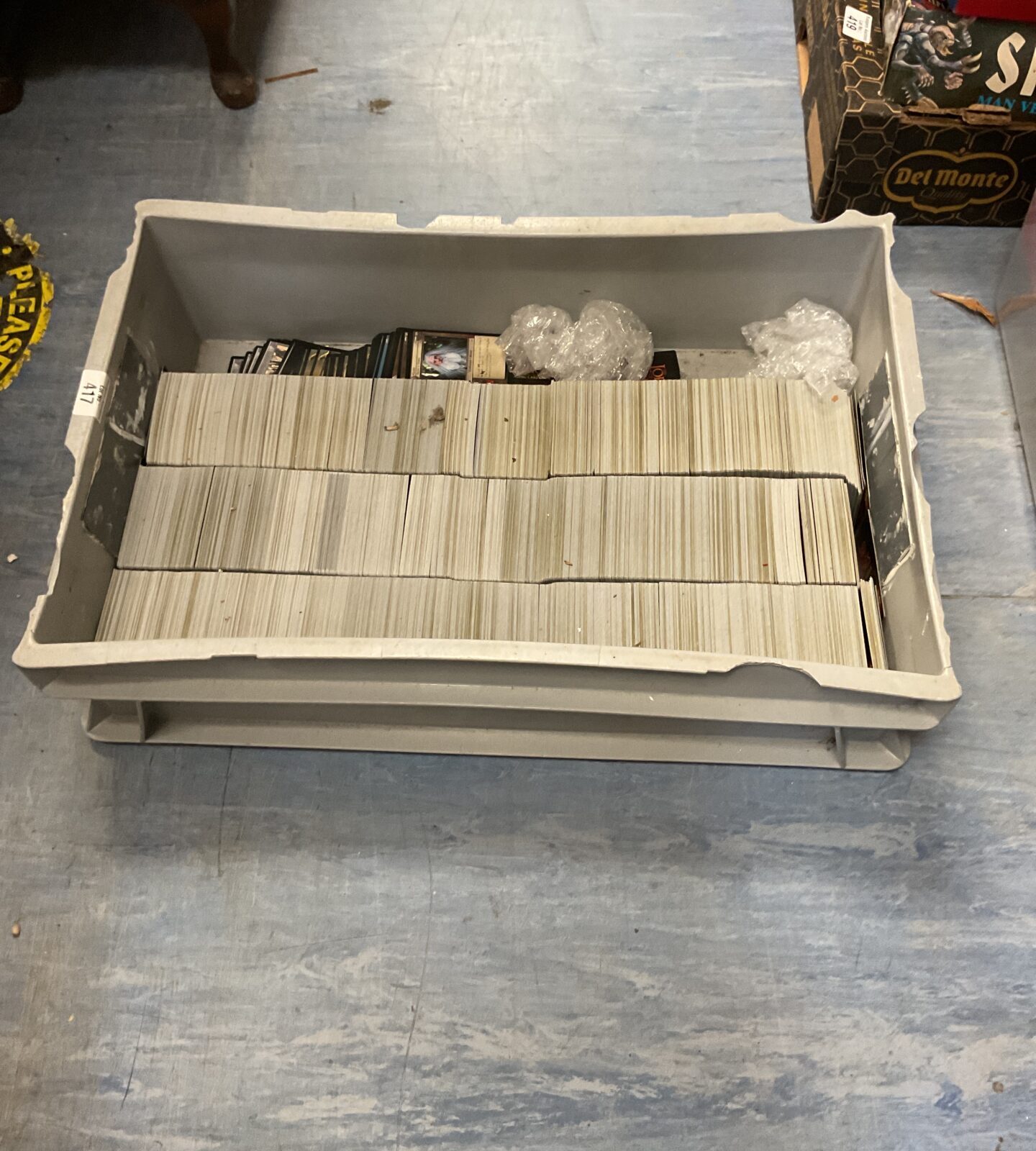 Large lot of Lord of the Rings trading cards in a box.