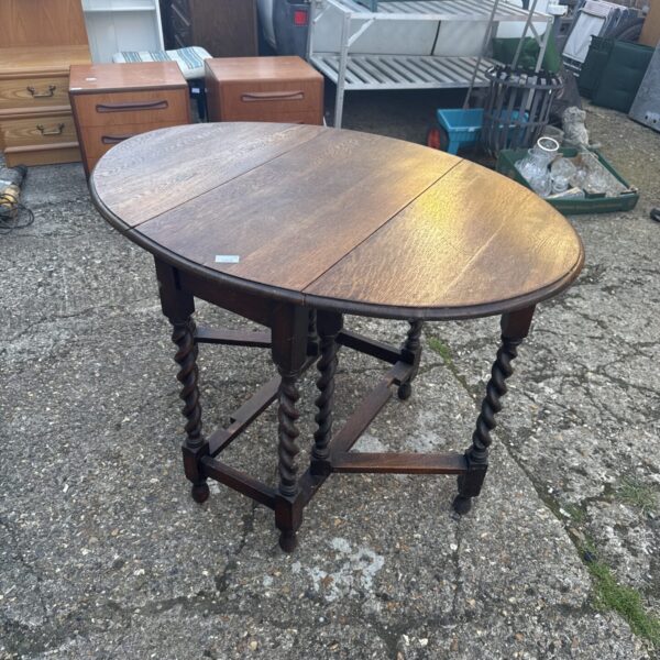 Vintage mahogany gate leg table with barley twist legs.