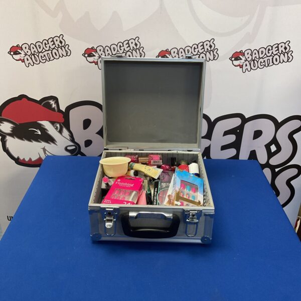 Black makeup case filled with a mixed lot of beauty products.