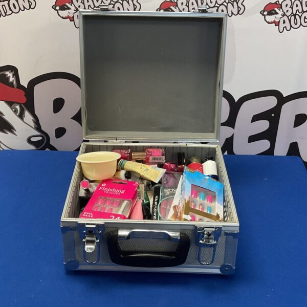Black makeup case filled with a mixed lot of beauty products.