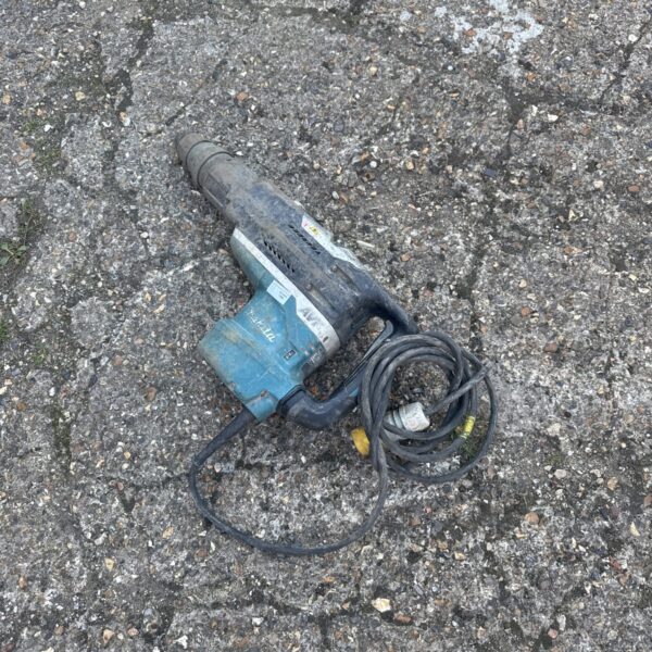 Makita HR5212C concrete breaker drill, a powerful demolition tool.