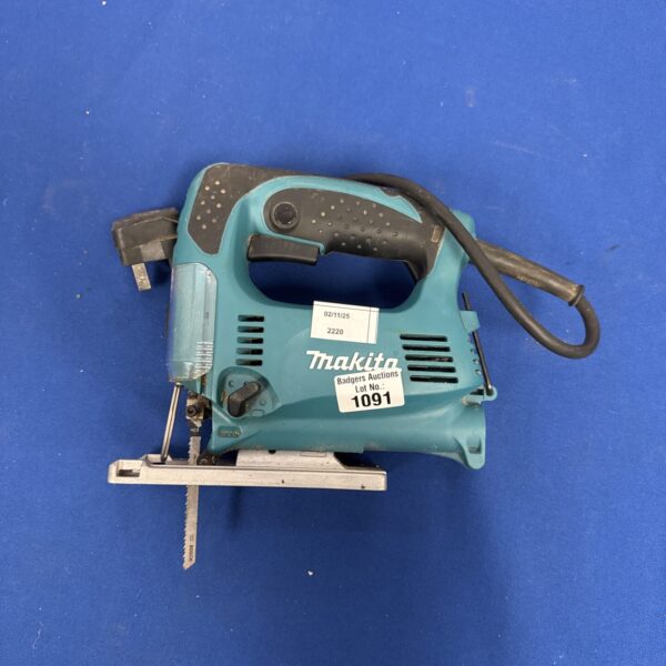 Used Makita jigsaw power tool for cutting wood and metal.