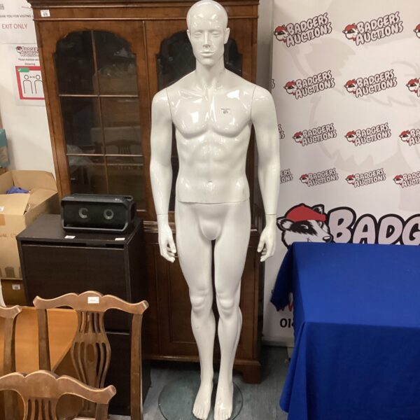 Full body male mannequin for clothing display.