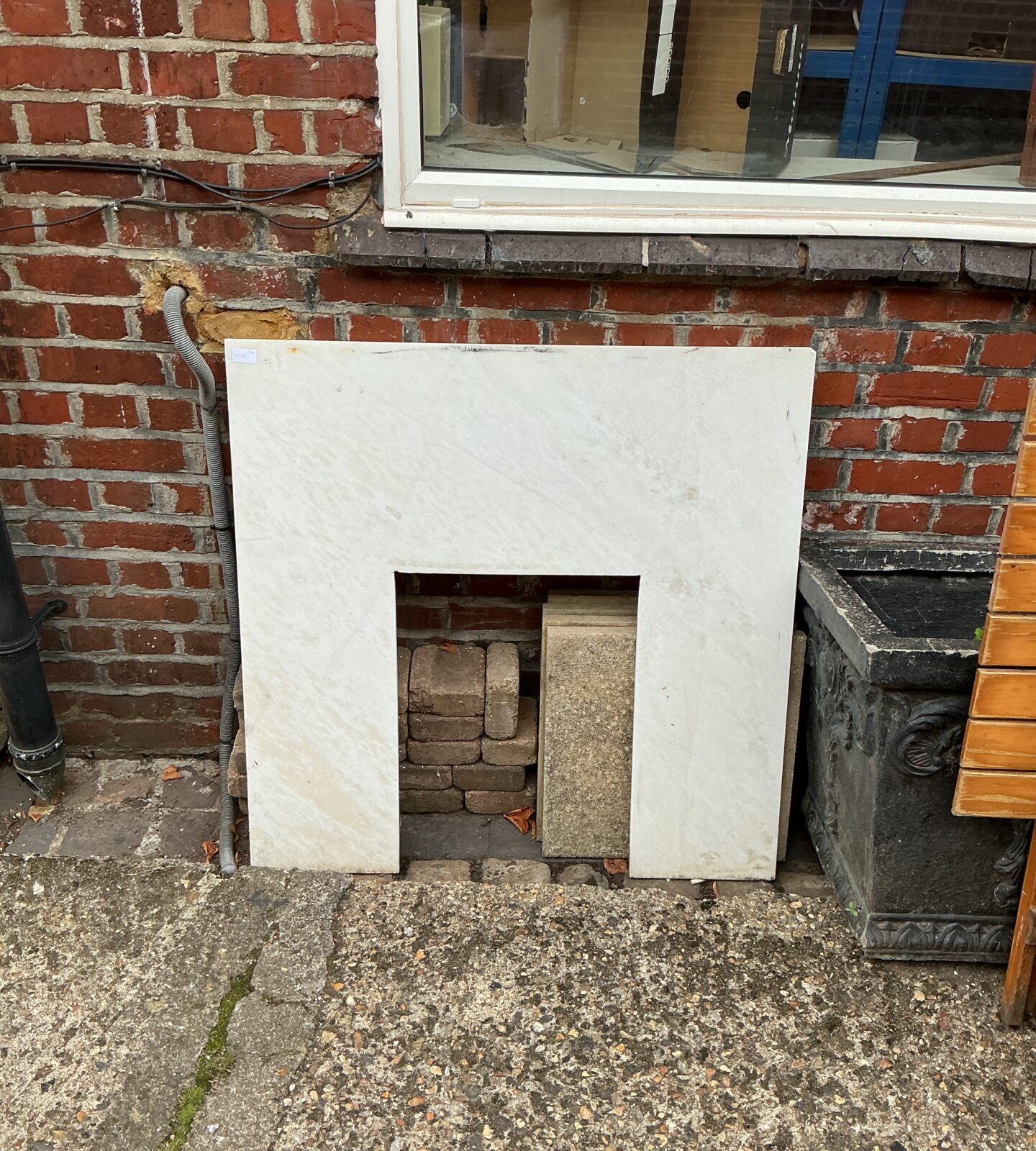 Vintage marble effect fire surround for a classic fireplace.