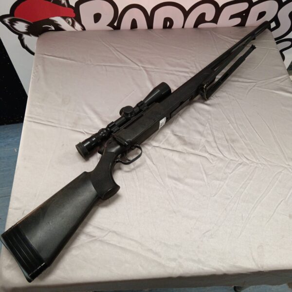 Maruzen APS2 airsoft rifle with scope and magazine, ready for action.