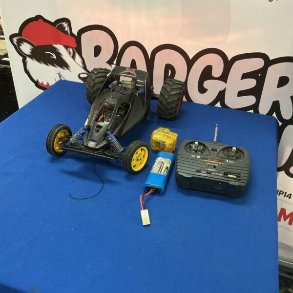 Vintage Marzccchi RC car with handset and charger for remote control fun.