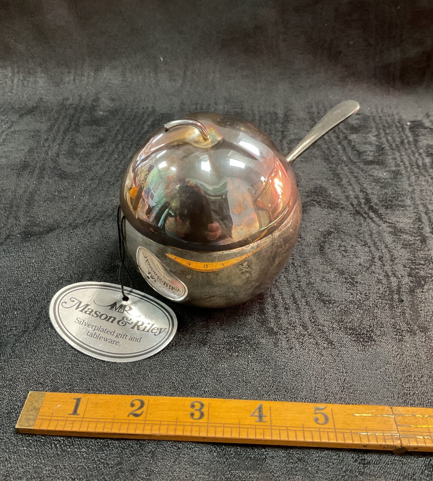 Close-up of antique Mason Riley apple sauce pot and spoon.