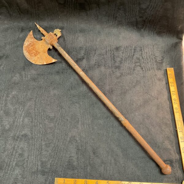 Detailed view of a medieval battle axe reproduction with steel head.