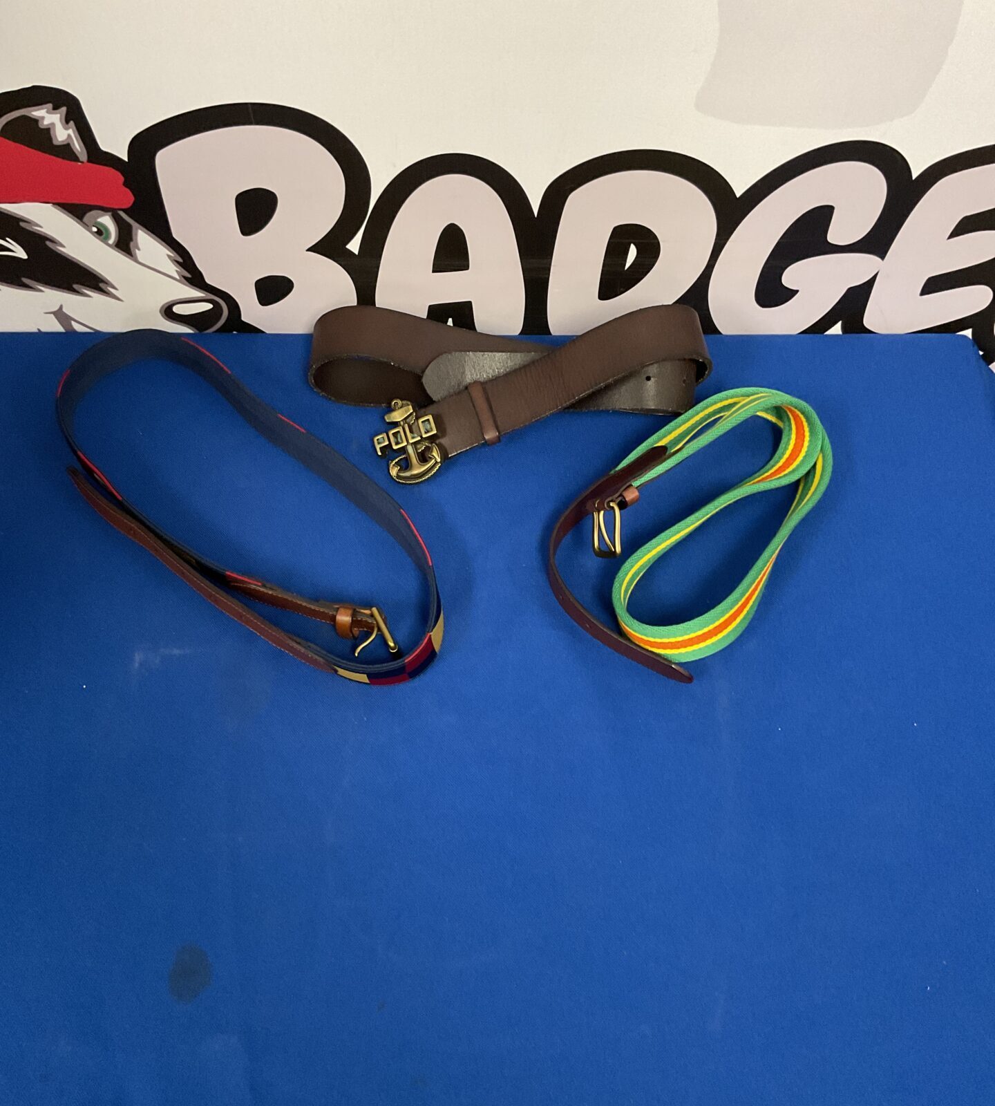 Lot of three men's leather belts in various styles.