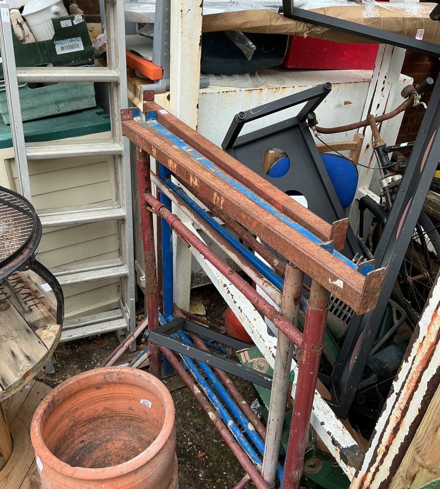 Vintage metal builder’s trestles for workshop or construction use.