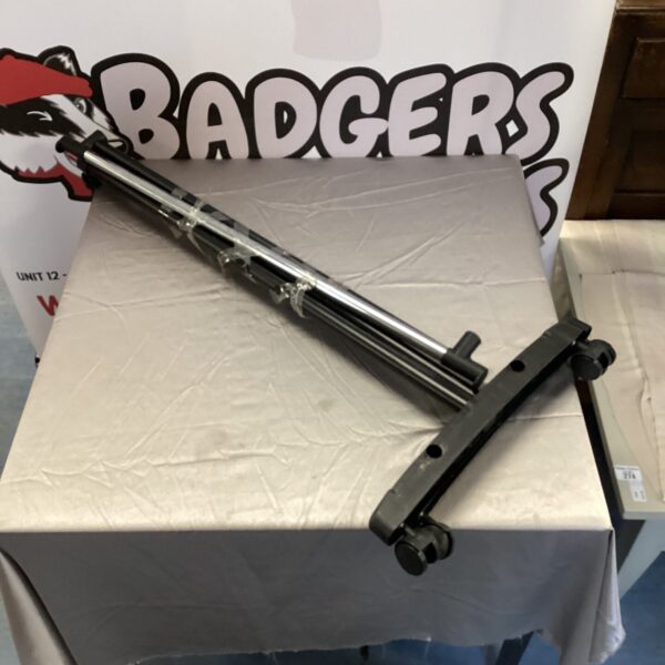 Silver metal clothes rail for hanging garments.