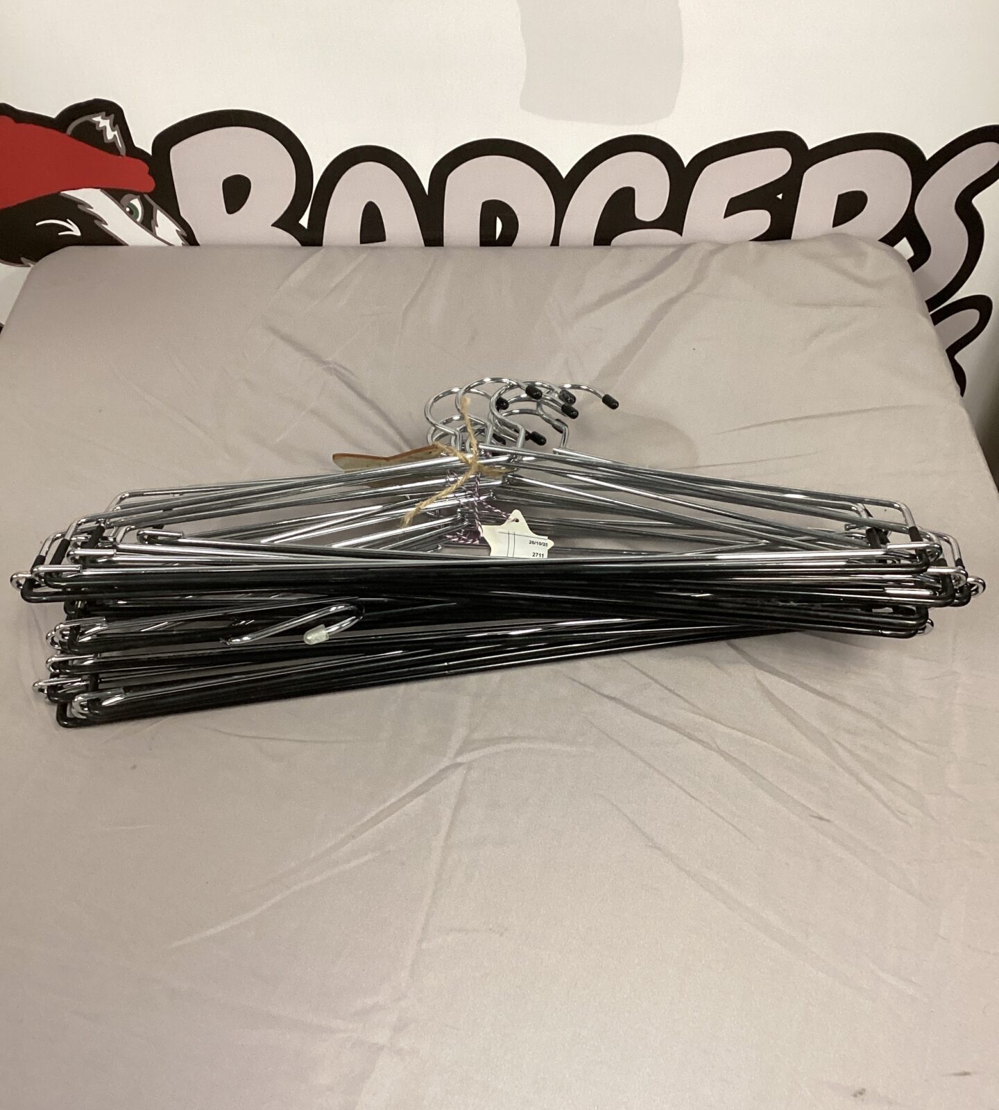 Lot of used metal clothing hangers for closet organization.