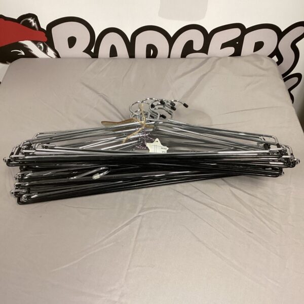 Lot of used metal clothing hangers for closet organization.