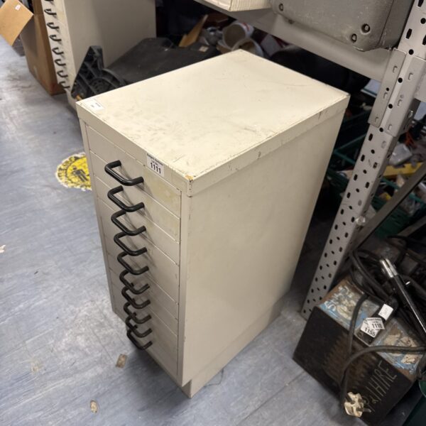 Front view of a vintage metal filing cabinet for office storage.
