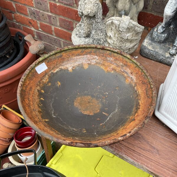 Vintage metal garden bird bath, weathered patina, outdoor garden feature.