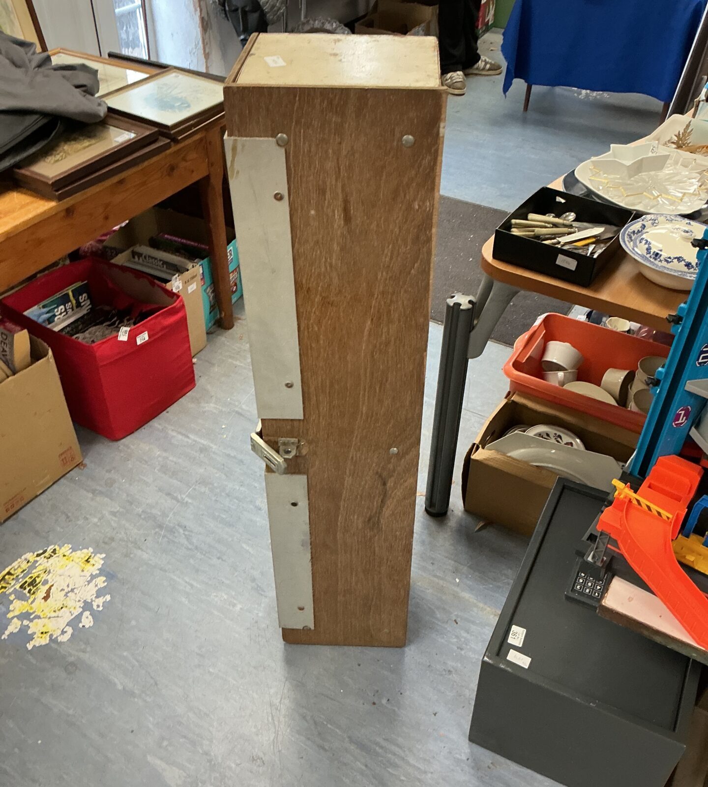 Close-up of the metal gun cabinet's locking mechanism.