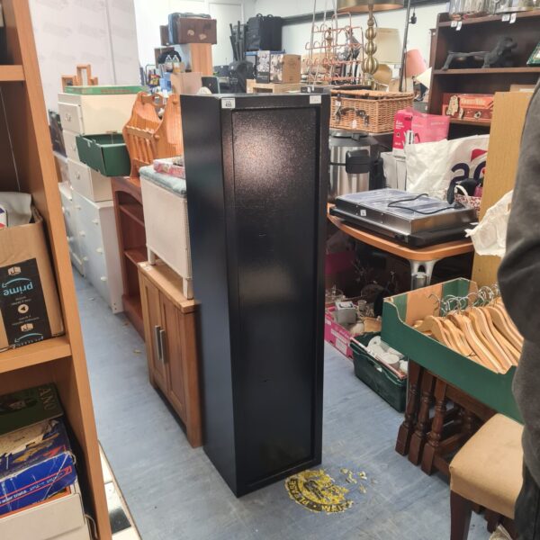 Front view of a used metal gun cabinet for secure firearm storage.
