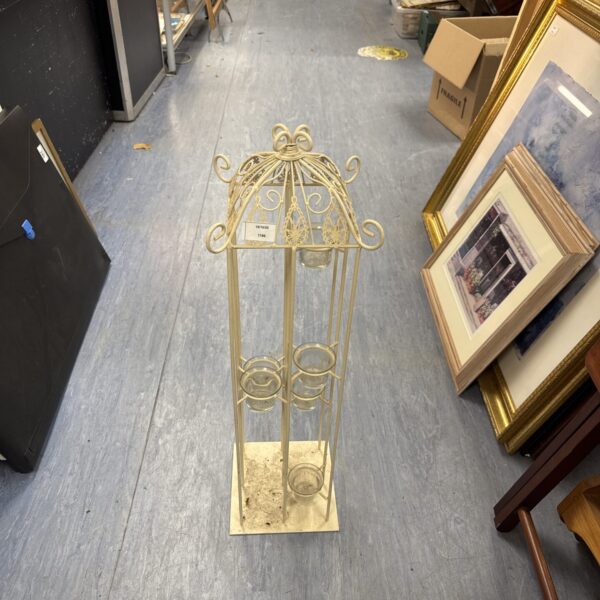 Elegant 28 inch metal tea light holder with intricate wire design.