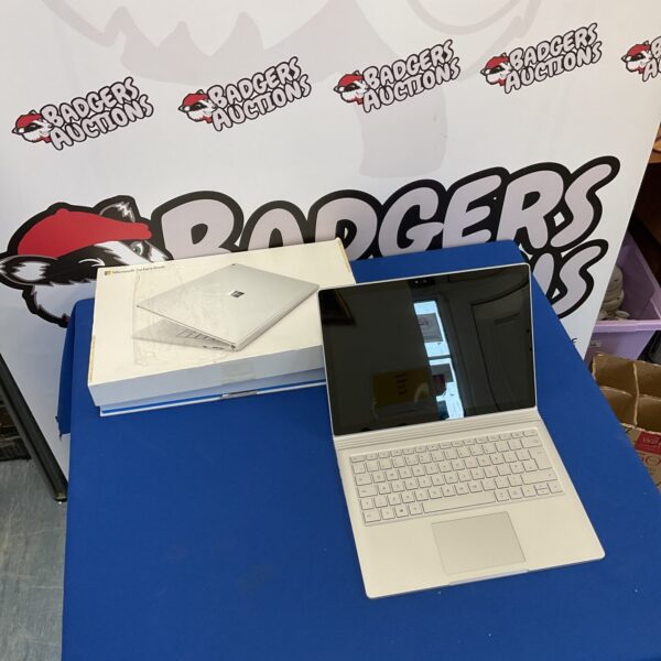 Used Microsoft Surface Book laptop with 256GB storage on display.