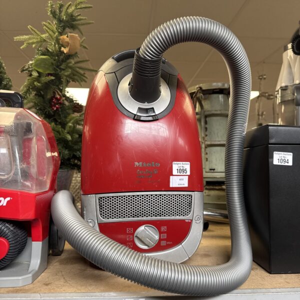 Red Miele Cat & Dog Turbo Team 5000 canister vacuum cleaner.