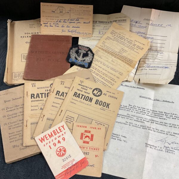 Vintage military ration books and pay book collection, WWII era.