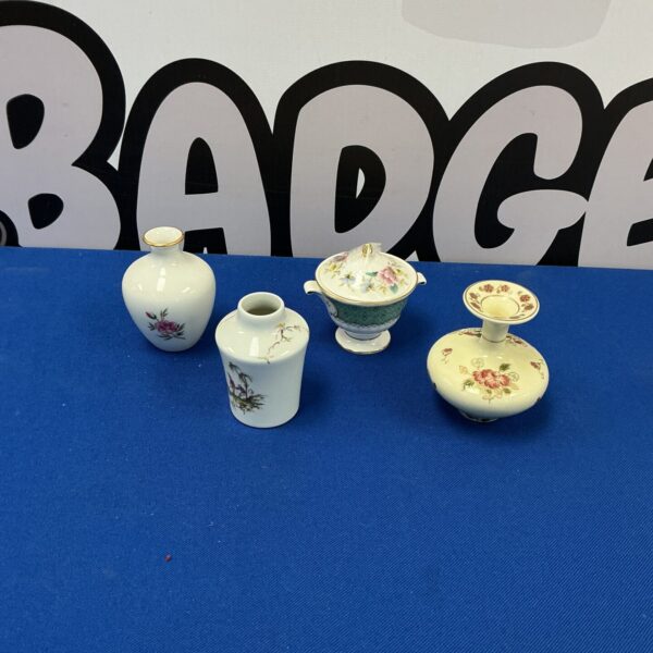 Collection of four miniature porcelain vases, including Limoges and Royal Doulton.