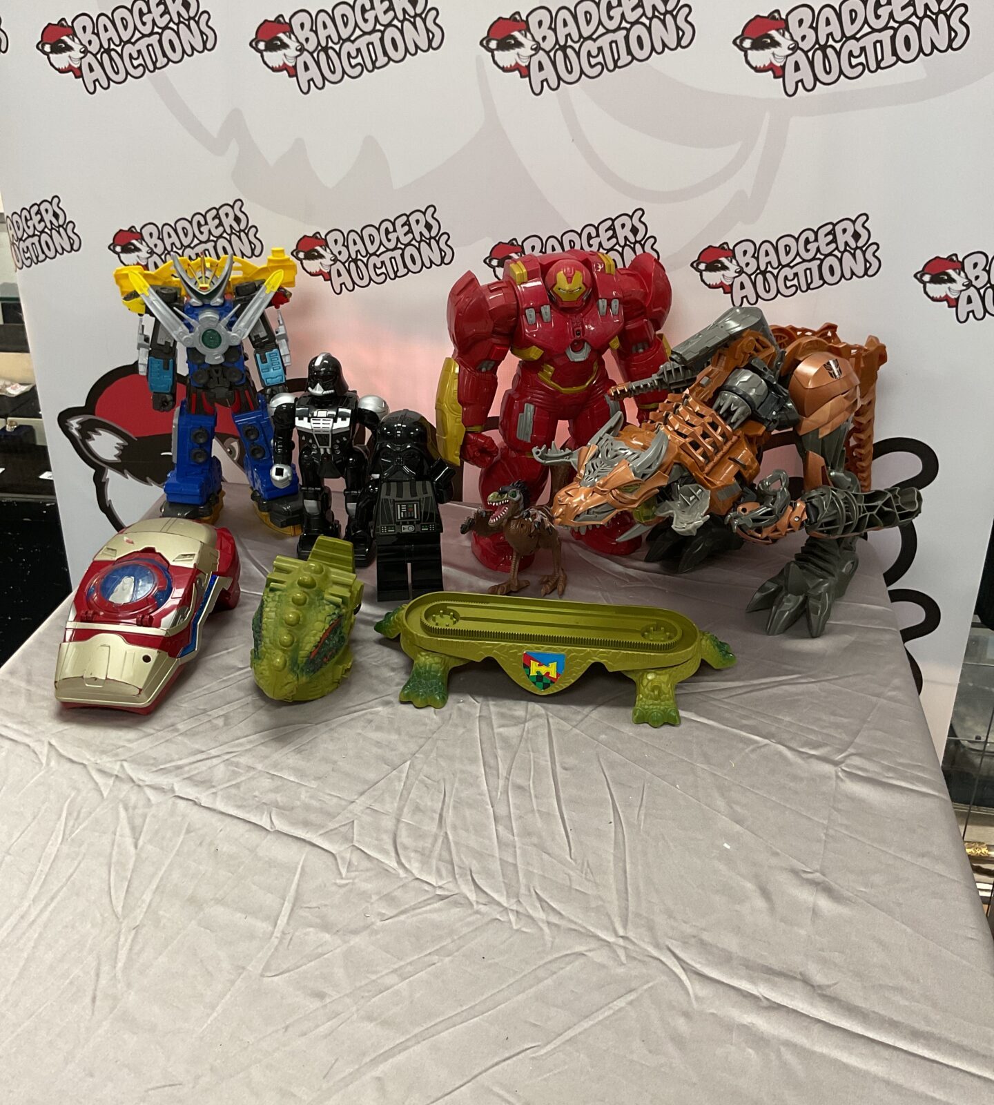 Mixed lot of action figures and toys including Marvel and Transformers.