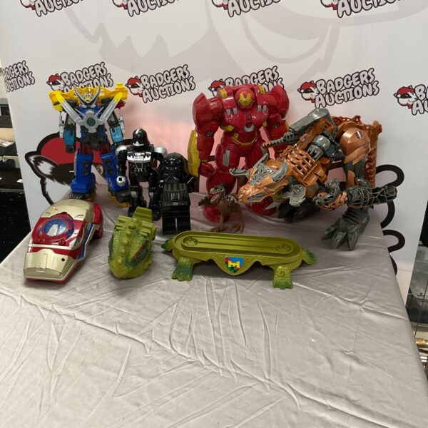 Mixed lot of action figures and toys including Marvel and Transformers.