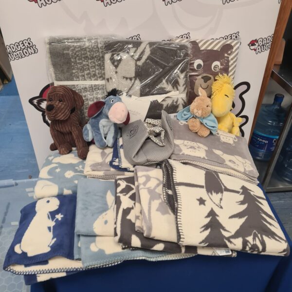 Mixed lot of blankets and soft toys including Disney characters.