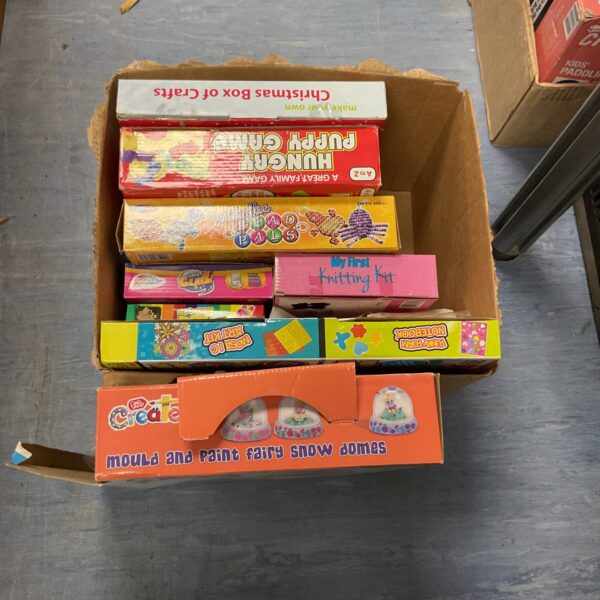 Mixed lot of board games and a Christmas craft box for family fun.
