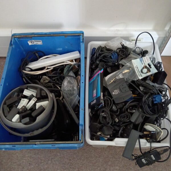 Mixed lot of cables and Xbox 360 batteries for gaming and electronics.