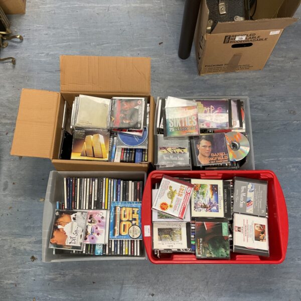Four boxes filled with a mixed CD lot for music collectors.
