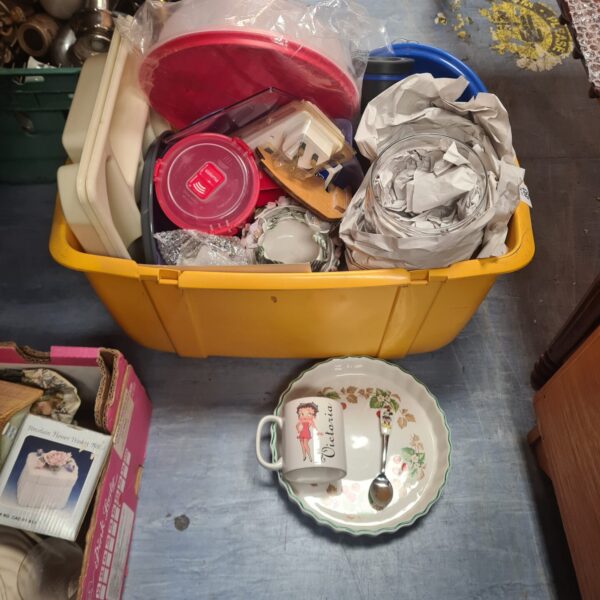 Mixed lot of vintage and modern china and dishes in a yellow container.