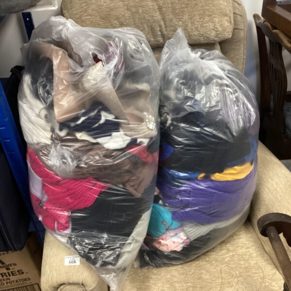 Large bundle of mixed clothing and footwear for resale.