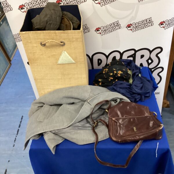 Mixed clothing lot bundle with various garments and textiles.