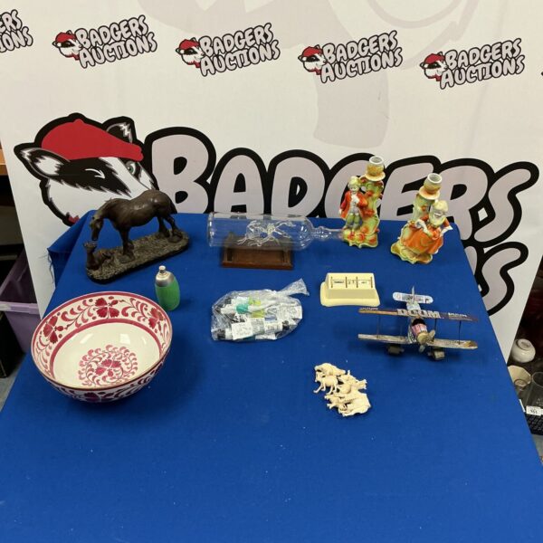 Mixed lot of vintage collectibles with Greyhound figurines in glass bottle.
