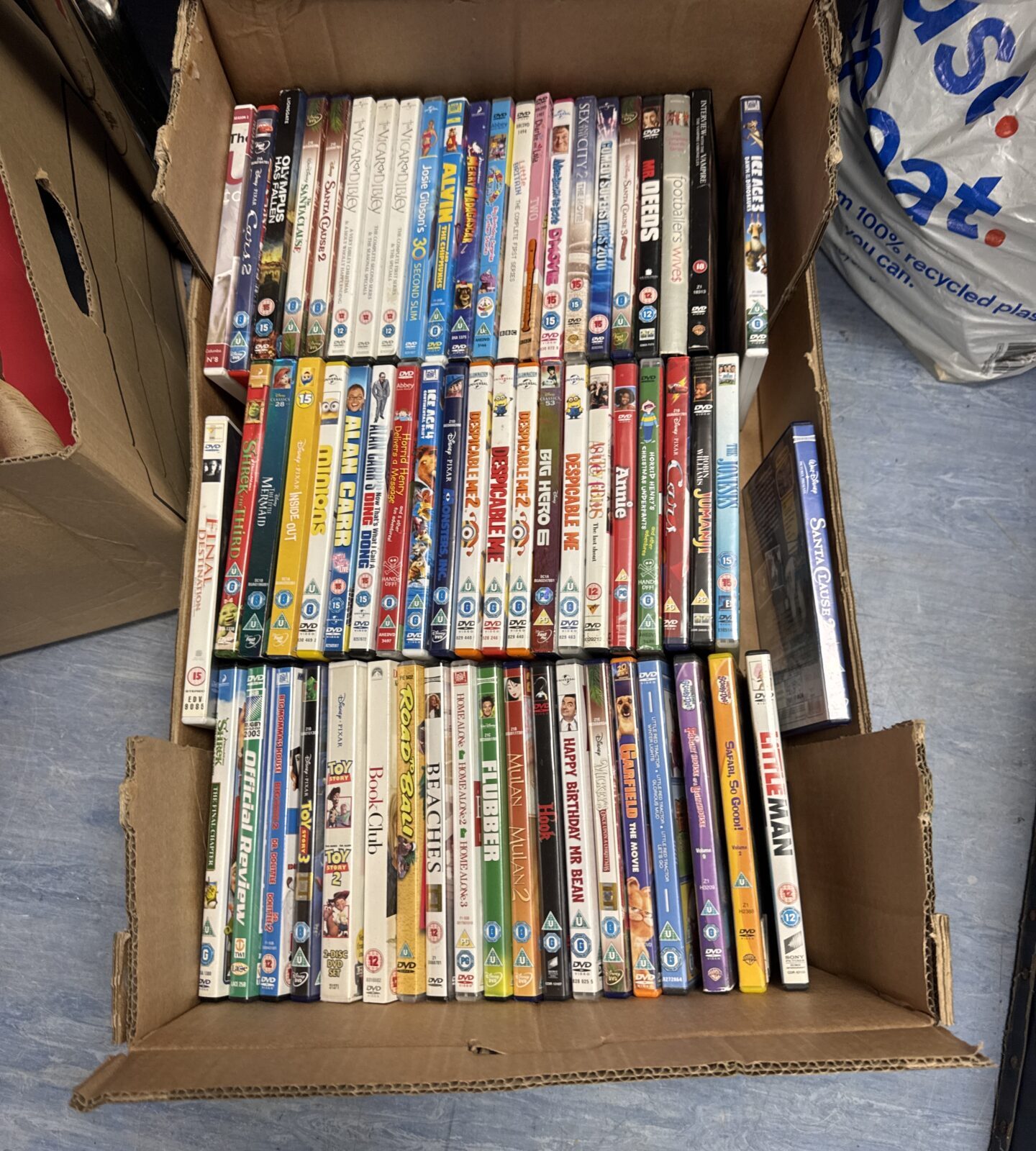 Tray of mixed DVDs including Hook and Big Hero 6.
