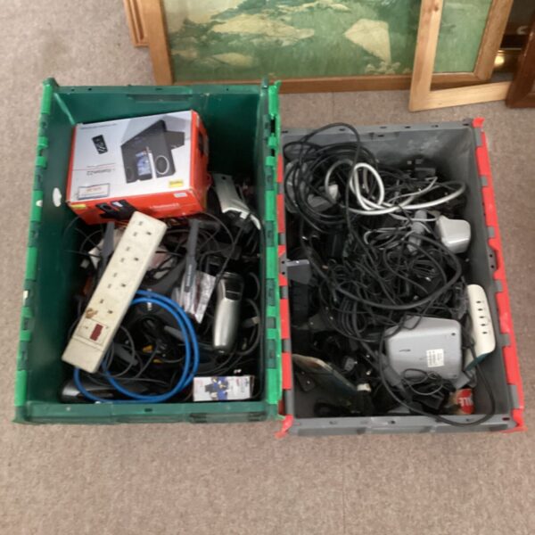 Mixed electronics lot with two crates of cables and components.