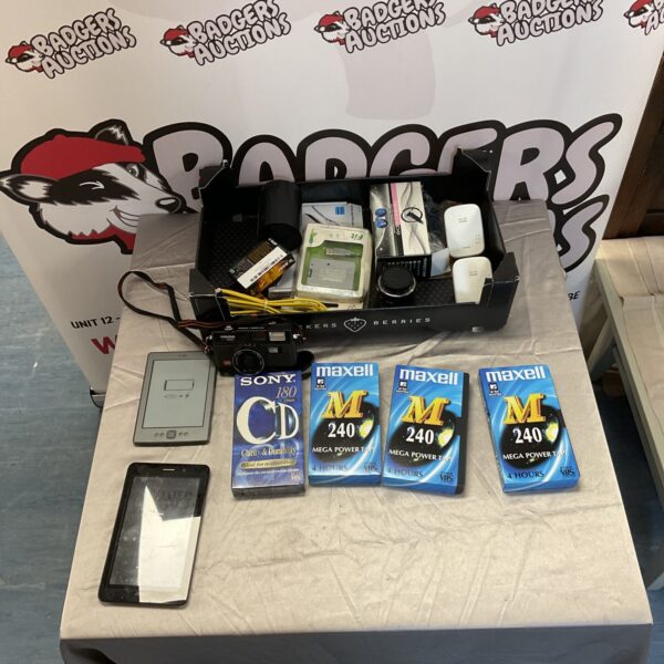 Mixed lot of vintage electronics including a camera and tablets.