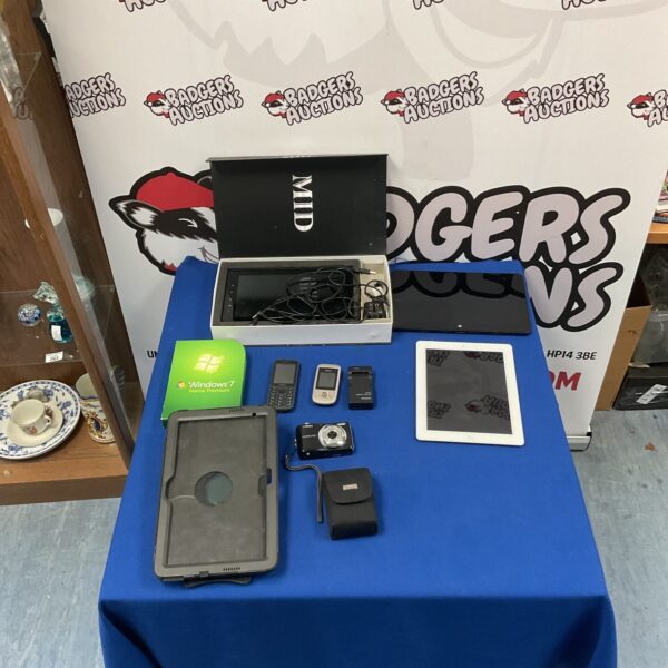 Mixed lot of electronics including iPad, Nikon camera and Nokia phones.