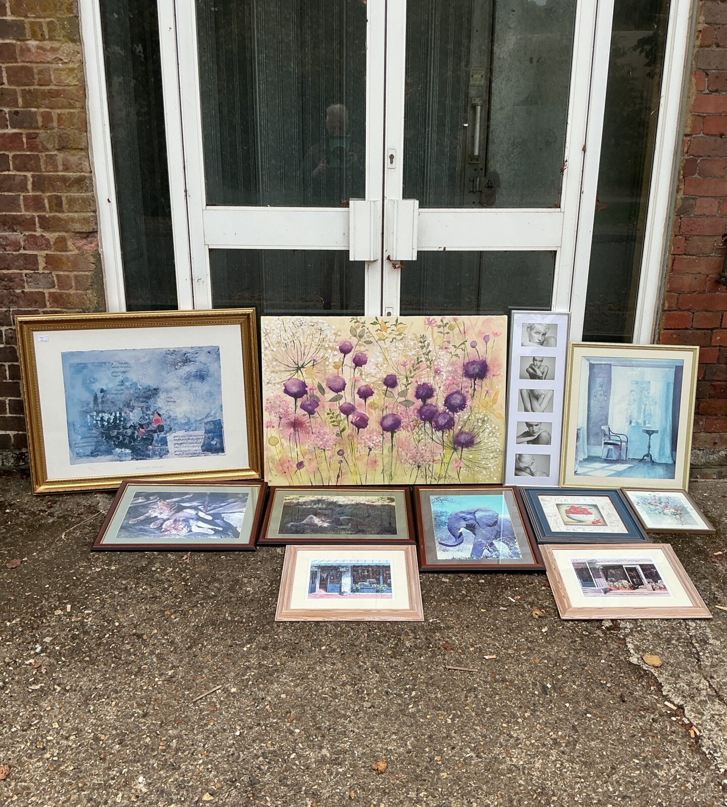 Mixed framed artwork and vintage photographs for home decor.
