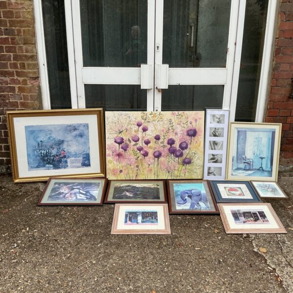 Mixed framed artwork and vintage photographs for home decor.