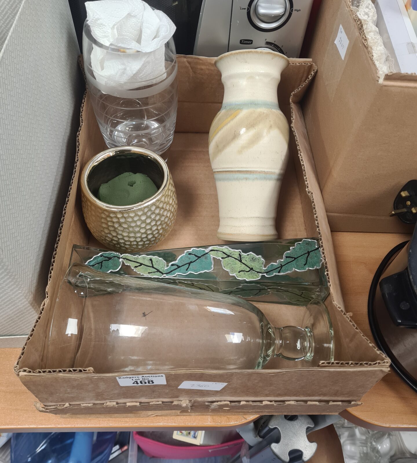 Mixed lot of colourful glass vases for home decor.