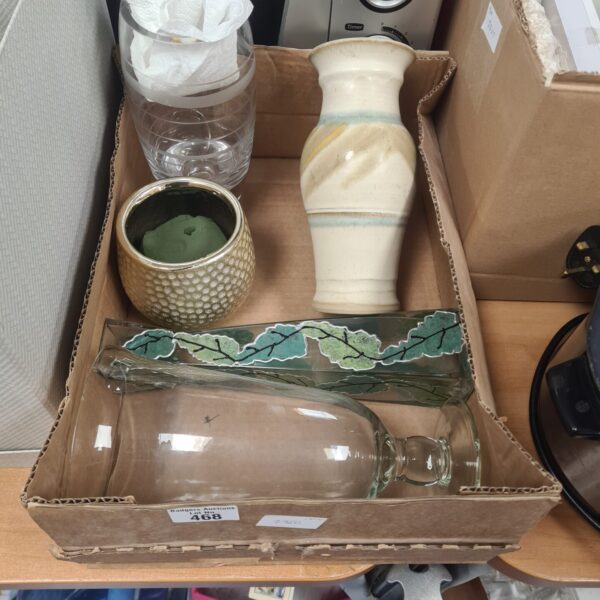 Mixed lot of colourful glass vases for home decor.